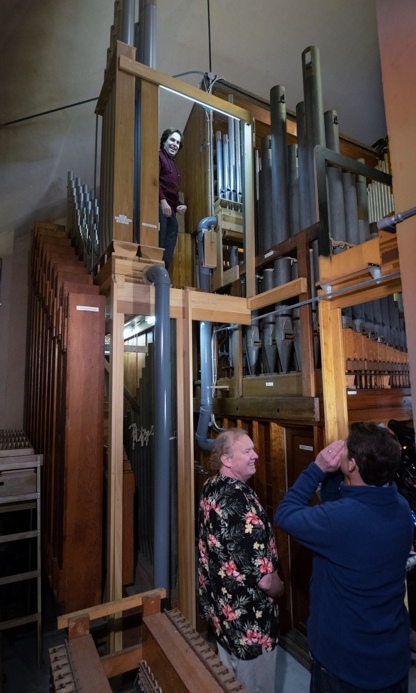 08 Raul showing off some of the oldest and newest pipes in the  organ R90